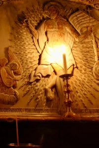 The Edicule: A solitary candle burning inside the Edicule, traditional site of the tomb of Christ