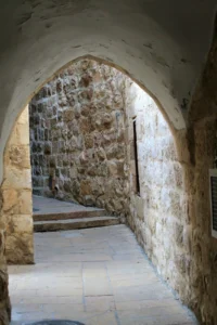 Sepulchre Passage: A narrow corridor that reveals the expansive entrance to the Church of the Holy Sepulchre