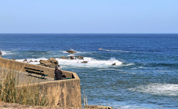 The couple found a perfect spot to enjoy the sun and the calm sea Port Vieux: Bay of Biscaye
