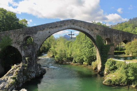 A Cross of Asturias hangs from a Roman bridge situated near the Lagos de Covadonga. Asturian cross