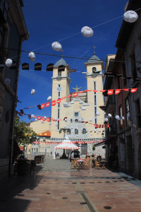 The town of Ribadessella along the Camino de Santiago (del Norte). The street leading to the church is festooned with scallop-shaped streamers. Ribadessella