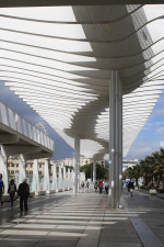 A covered walkway at the Port of Málaga. The sun shade produces a fascinating shadow pattern Port of Malaga