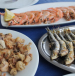 Seafood freshly prepared at he chiringuito: grilled sardines, fried baby squid, gambas a la plancha. Chiringuito food